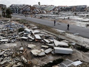 Rescue personnel search amidst debris in the aftermath of Hurricane Michael in Mexico Beach, Fla., Thursday, Oct. 11, 2018. (AP Photo/Gerald Herbert) ORG XMIT: FLGH108