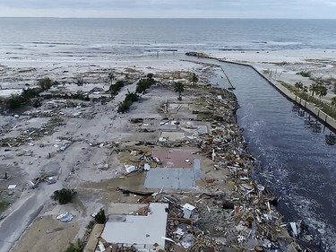 In this image made from video and provided by SevereStudios.com, damage from Hurricane Michael is seen in Mexico Beach, Fla. on Thursday, Oct. 11, 2018. Search-and-rescue teams fanned out across the Florida Panhandle to reach trapped people in Michael's wake Thursday as daylight yielded scenes of rows upon rows of houses smashed to pieces by the third-most powerful hurricane on record to hit the continental U.S. (SevereStudios.com via AP) ORG XMIT: AX103