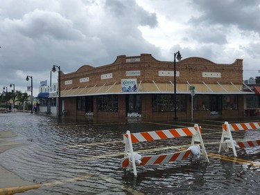 High tide from offshore Hurricane Michael creeps up into the Sponge Docks in Tarpon Springs, Fla., Wednesday, Oct. 10, 2018 after the Anclote River backs up. (Jim Damaske/The Tampa Bay Times via AP) ORG XMIT: FLPET102
