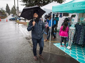 NDP Leader Jagmeet Singh visits the Rumble on Gray Street Fair on a rainy Saturday in Burnaby, B.C., last month.