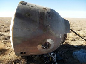 The Soyuz MS-10 space capsule lies in a field after an emergency landing near Dzhezkazgan, about 450 km northeast of Baikonur, Kazakhstan, Thursday, Oct. 11, 2018.