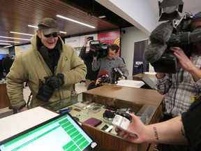 The first customer at Nova Cannabis, Gary, purchased blue Dream at the store in Calgary, on Wednesday October 17, 2018. Leah Hennel/Postmedia