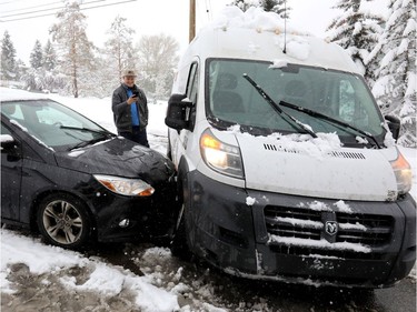 Accident on the 19th Street and 10th Avenue N.W. during a snowstorm in Calgary on Tuesday, Oct. 2, 2018.
