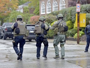 Polikce respond to an active shooter situation at the Tree of Life synagogue on Wildins Avenue in the Squirrel Hill neighbourhood of Pittsburgh, Pa., on Saturday, October 27, 2018.