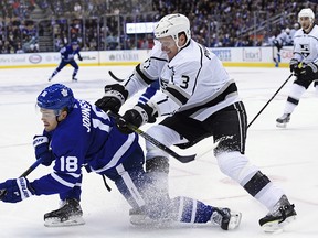 Los Angeles Kings defenceman Dion Phaneuf hits Toronto Maple Leafs left wing Andreas Johnsson during second period NHL action in Toronto on Monday, Oct. 15, 2018.