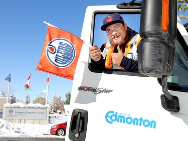 Gregory Stapleton, a snow plow operator for the City of Edmonton, gets ready to help Calgary clean up on Wednesday, Oct. 3, 2018, one day after a  storm dumped more than 30 cm of snow.
