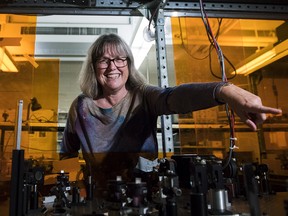 Noble Prize winner Donna Strickland shows the media her lab after speaking about her prestigious award in Waterloo, Ont., on Tuesday, Oct. 2, 2018. Strickland is among three physicists who were awarded the prize earlier today for groundbreaking inventions in the field of laser physics. Strickland is one of only three women ever to win the Nobel Prize for physics.