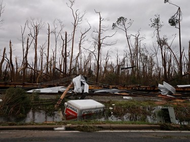 Shredded trees, derailed train cars and a sunken trailer are seen in the aftermath of Hurricane Michael in Panama City, Fla., Wednesday, Oct. 10, 2018.