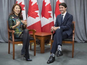 Prime Minister Justin Trudeau meets with CEO of China and Co-CEO of Asia Pacific for Morgan Stanley Wei Sun Christianson at the Fortune Global Forum in Toronto on Monday, Oct. 15, 2018.