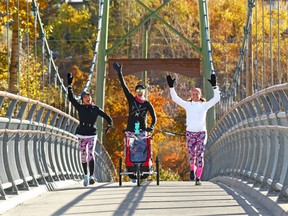 Friends from left; Kitty Honeychurch, Leah Brooks (pushing son Blake, 14 months) and Linda Kepler showed their enthusiasm for a great day for a run as they crossed the Rideau Park Bridge on Sunday morning, October 14, 2018. The week ahead looks good too, with sun and double digit highs forecast.