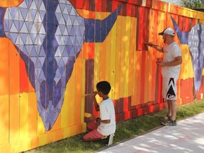 The Northern Hills Mural Project drew community members out to help paint large murals.