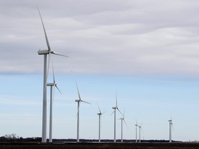 Wind turbines stand in a field near Northwood, Iowa. A new study out of Harvard finds that ramping up wind power in America would also dial up the nation's temperatures.
