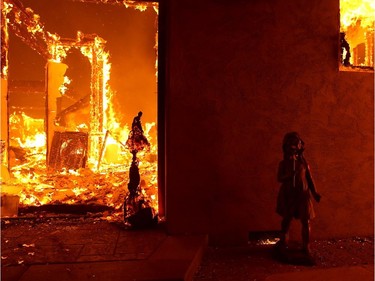 A home burns as the Camp Fire moves through the area on Nov. 8, 2018 in Paradise, California. Fuelled by high winds and low humidity, the rapidly spreading Camp Fire has ripped through the town of Paradise and has quickly charred 18,000 acres and has destroyed dozens of homes in a matter of hours. The fire is currently at zero containment.