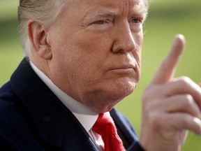 U.S. President Donald Trump answers questions from the press while departing the White House November 29, 2018 in Washington, DC.