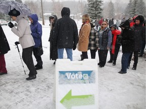 Calgarians line up at the advance polling station in Bowness on Tuesday, Nov. 6, 2018, to cast their ballot in the Olympic plebiscite.