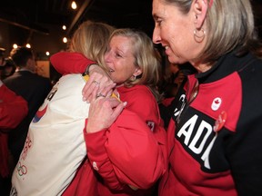 Mary Moran, Calgary 2026 CEO, centre, reacts to news that Calgarians have voted against a 2026 Olympic bid on Tuesday Nov. 13, 2018.