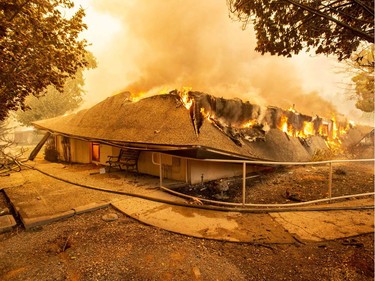 The Feather River Hospital burns down during the Camp fire in Paradise, California on November 8, 2018. More than 18,000 acres have been scorched in a matter of hours burning with it a hospital, a gas station and dozens of homes.