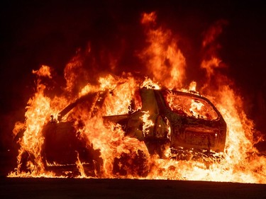 A car explodes into flames as the Camp fire tears through downtown Paradise, California on Nov. 8, 2018. A rapidly spreading, late-season wildfire in northern California has burned 20,000 acres of land and prompted authorities to issue evacuation orders for thousands of people.