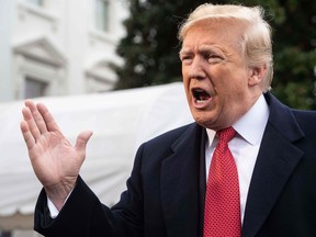 Donald Trump speaks to the press before departing the White House for Paris on November 9, 2018 in Washington, DC.