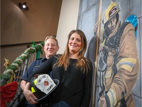 Carmelle Sproule with Mike Carter, president of the Calgary Firefighters Association. Sproule's Douglasglen home was destroyed by fire Jan. 9, 2017. The Calgary Firefighters Charitable Foundation is one of 12 recipients of the 2018 Calgary Herald Christmas Fund. Al Charest/Postmedia