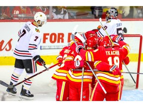 Calgary Flames Sean Monahan celebrates with teammates after scoring against the Chicago Blackhawks in NHL hockey at the Scotiabank Saddledome in Calgary on Saturday, November 3, 2018. Al Charest/Postmedia