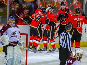 Calgary Flames James Neal celebrates with teammates after scoring against the Colorado Avalanche in NHL hockey at the Scotiabank Saddledome in Calgary on Thursday, Nov. 1, 2018.