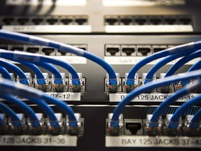 Canadian banks are combating cyberattackers by hiring their own in-house ethical hackers and investing in cybersecurity research. Networking cables on a batch board are shown in Toronto on Wednesday, Nov. 8, 2017.