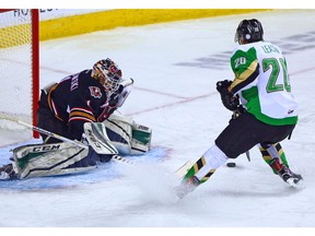 Calgary Hitmen goaltender Carl Stankowski stopped this shot by the Prince Albert Raiders' Brett Leason during WHL action in Calgary on Monday October 8, 2018. Gavin Young/Postmedia