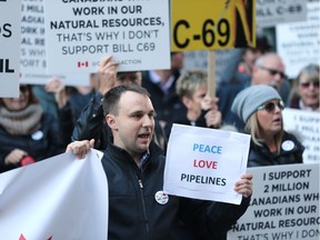 Protesters rally against Bill C-69 in downtown Calgary on Nov. 27, 2018, before Finance Minister Bill Morneau was to speak at the Telus Convention Centre.