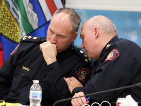 Acting Police Chief Steve Barlow and Deputy Chief Paul Cook talk during a Calgary Police Commission meeting on Tuesday November 27, 2018.  Gavin Young/Postmedia
