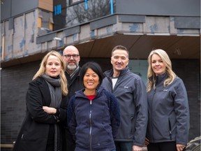 Mairi and Kevin Nyhoff, left, from Nyhoff Architecture and Brigette Lepage and Barry Laidlaw, right, from Capstone Custom Homes with home owner Ethel Nakano, centre, in Erlton.