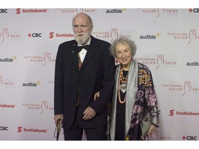 Margaret Atwood and Graeme Gibson stop on the red carpet at the Scotiabank Giller Bank Prize gala in Toronto on November 19, 2018. Canadian literary great Margaret Atwood is writing a sequel to her internationally renowned dystopian novel "The Handmaid's Tale." Publisher McClelland and Stewart says it will publish "The Testaments" on Sept. 10, 2019.