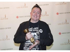 Mike Ward holds up his trophy for best podcast at the gala Olivier awards ceremony in Montreal on December 10, 2017.