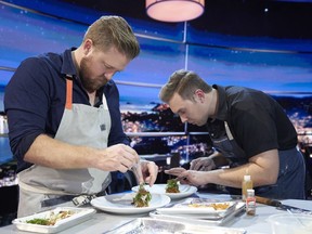 Chefs Timothy Hollingsworth, left, and Darren MacLean are shown in a scene from Netflix's "The Final Table" in this undated handout photo.