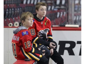 Carson (L) and Jackson Haugan are pictured as they take Calgary Flames practice Calgary on Friday. Photo by Jim Wells/Postmedia.