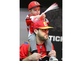 A youngster gets a ride above the crowd during the Calgary Flames Red Rally for fans at the Saddledome in Calgary on Sunday, November 4, 2018. The family event allowed fans to watch an open practice, get autographs from some current and alumni players and games on the concourse. Jim Wells/Postmedia