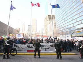 Calgary Police close off the area around the Hyatt Regency Hotel in Calgary on Thursday, November 22, 2018. Over 1000 protesters surrounded the hotel, prompting police to shut down the main streeet in front of the hotel where Prime Minister Justin Trudeau will be speaking. Jim Wells/Postmedia