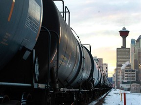 A train carrying oil cars passes through Calgary on Nov. 29, 2018.