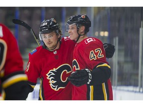 PENTICTON,BC:SEPTEMBER 8, 2017 -- Calgary Flames Juuso Valimaki (42) celebrates with teammate Rasmus Andersson after scoring agains the Edmonton Oilers during the NHL Young Stars Classic hockey action at the South Okanagan Events Centre in Penticton, BC, September, 8, 2017. (Richard Lam/PNG) (For ) 00050534A