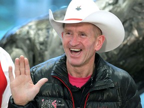 Michael 'Eddie the Eagle' Edwards is white-hatted as he arrives at Calgary International Airport in Calgary from the United Kingdom on Sunday, November 4, 2018.
