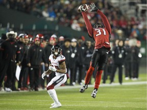 Calgary Stampeders defensive back Tre Roberson (31) knocks down a pass intended for Ottawa Redblacks wide receiver Diontae Spencer (85) during the first half of the 106th Grey Cup in Edmonton, Alta. Sunday, Nov. 25, 2018.
