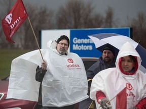 Union members block the entrance to the General Motors plant in  Oshawa, Ont., on Nov. 26, 2018, after the company announced it would close the facility in the new year.