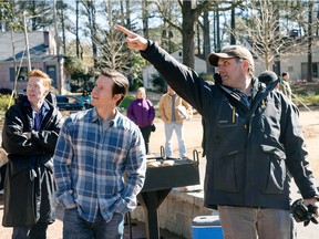 Mark Wahlberg gets some advice from Instant Family director Sean Anders. Anders wrote the comedy-drama based on his own experiences fostering three children.