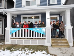 Jack James students celebrate the finished home they worked on with Homes by Avi.