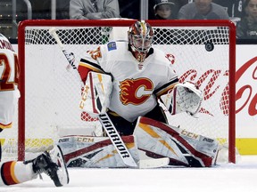 Calgary Flames goaltender David Rittich blocks a shot during the third period of an NHL hockey game against the Los Angeles Kings in Los Angeles, Saturday, Nov. 10, 2018. The Flames won 1-0.