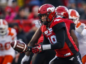 Calgary Stampeders quarterback Bo Levi Mitchell hands off the ball against the BC Lions in Calgary on Oct. 13, 2018.