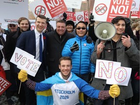 Calgary councillors L-R, Jeromy Farkas, Joe Magliocca and Sean Chu as NoCalgaryOlympics and Canadian Taxpayers Federation held a rally at Olympic Plaza in Calgary on Saturday November 10, 2018. Darren Makowichuk/Postmedia