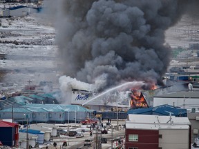 A fire burns at a Northmart store in Iqaluit, Nunavut, on Thursday, Nov. 8, 2018.