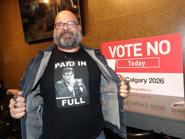 Shawn Alain flashes his shirt at the No Calgary for the plebiscite for the Olympics 2026 at the Kensington Legion in Calgary on Tuesday Nov. 13, 2018.