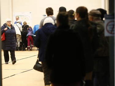 A steady line up at the Bowness Community Association as Calgary votes for the Olympics on Tuesday Nov. 13, 2018.